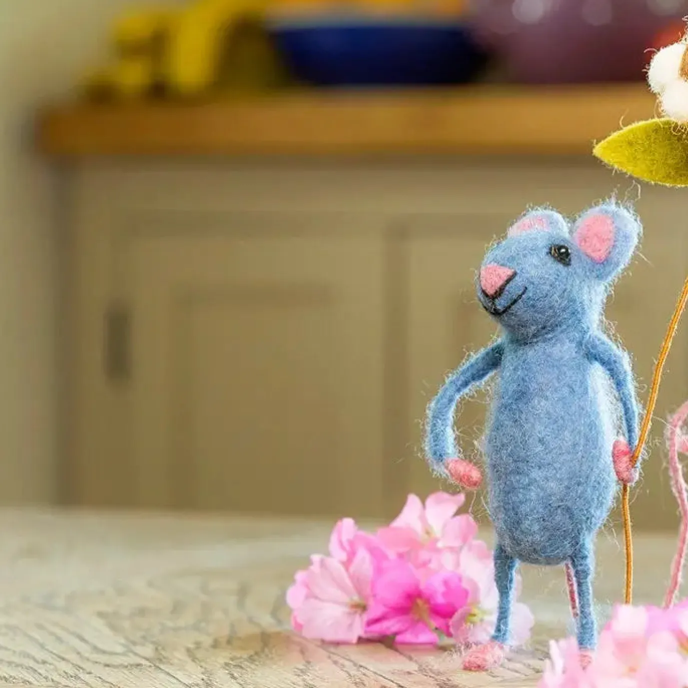 Blue Mouse Holding A Flower